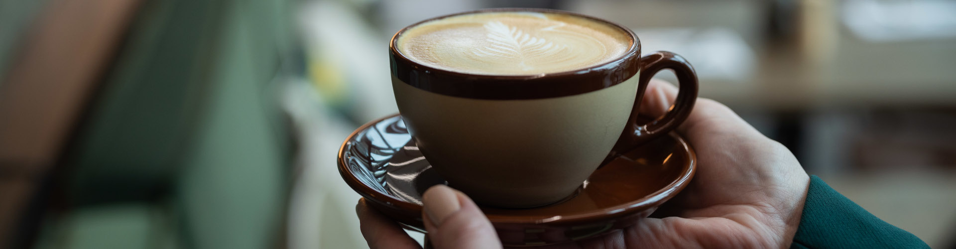 Barista-made coffee with latte art served in a cup
