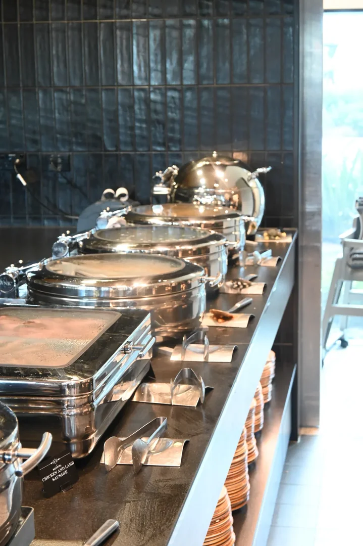 Drinks station at THIRTEEN50 Kitchen & Bar near Auckland Airport with iced tea and citrus water